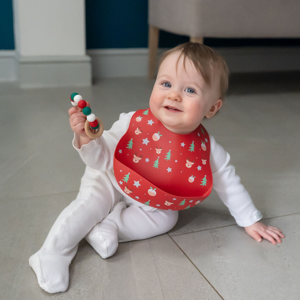 Ziggle- Catch It Silicone Bib Christmas- Baby at the bank