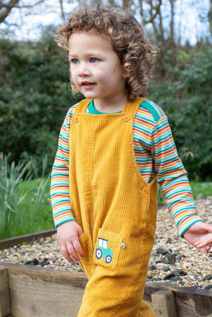 Frugi- Adley Cord Dungarees Gold/Tractor- Baby at the bank