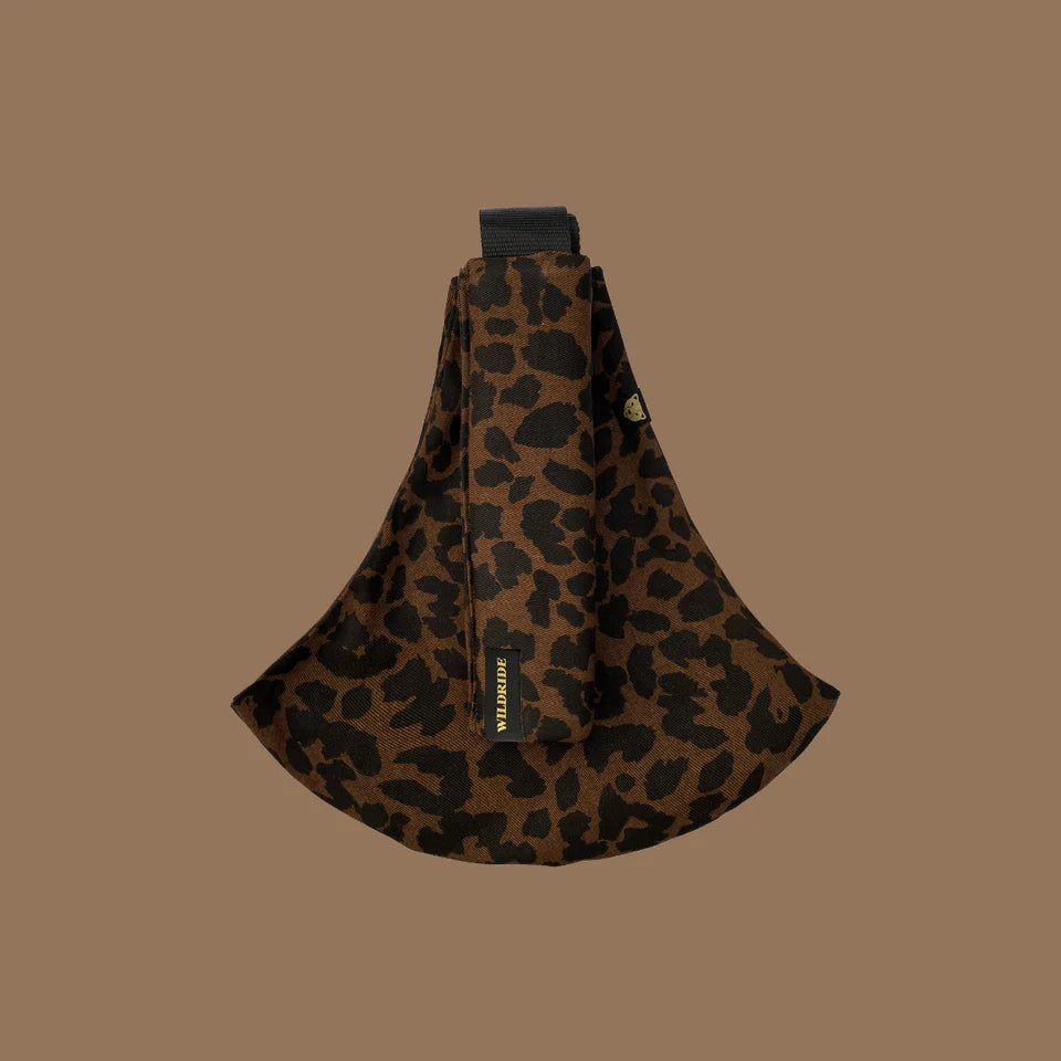 Wildride- Toddler Carrier Brown Leopard- Baby at the bank