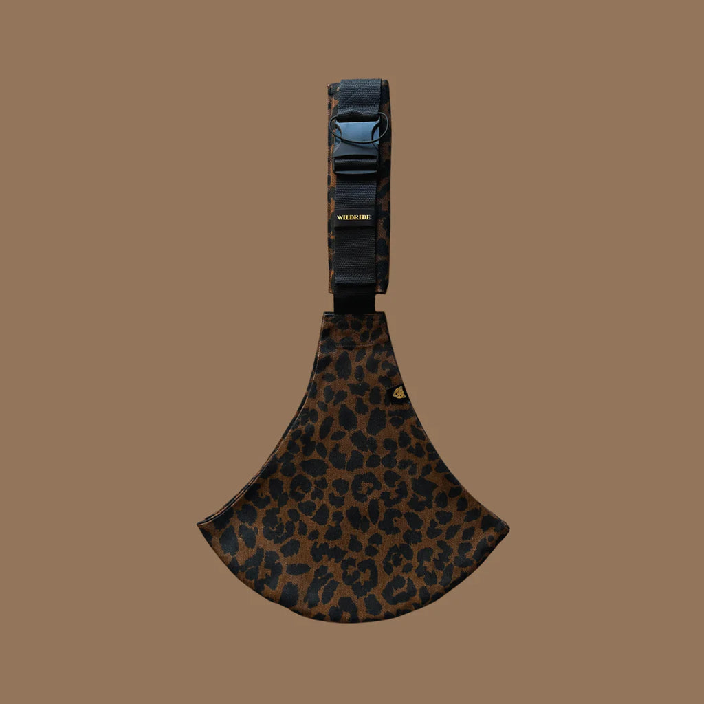 Wildride- Toddler Carrier Brown Leopard- Baby at the bank