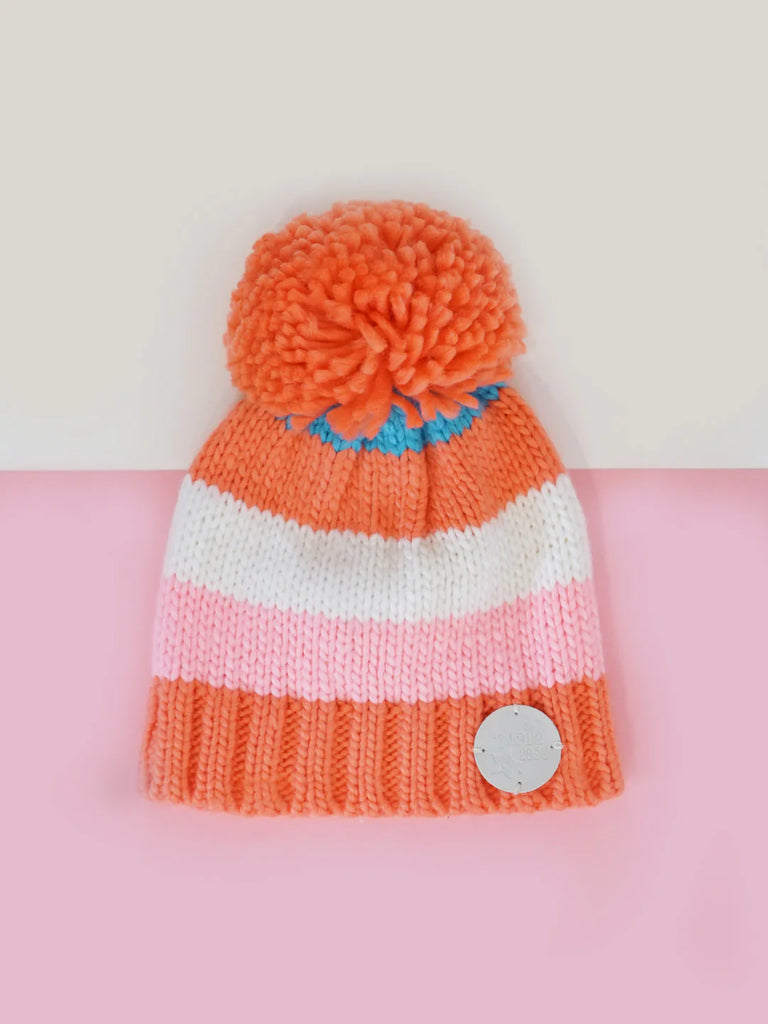 Blade and Rose- Coral and Cream Striped Bobble Hat- Baby at the bank