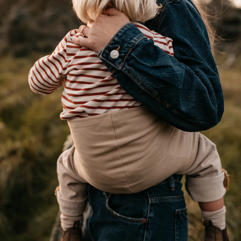 Wildride- Toddler Carrier Beige- Baby at the bank