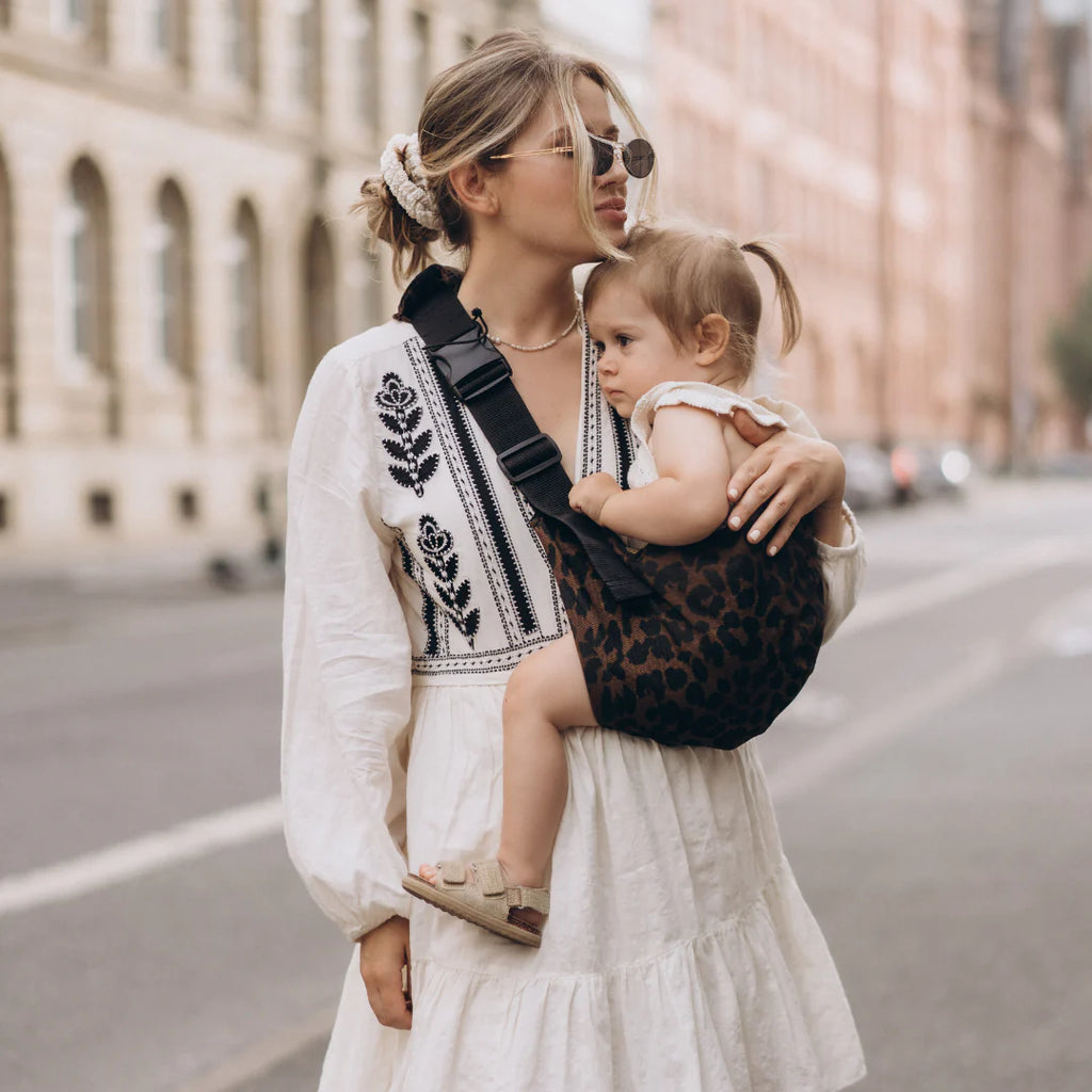 Wildride- Toddler Carrier Brown Leopard- Baby at the bank