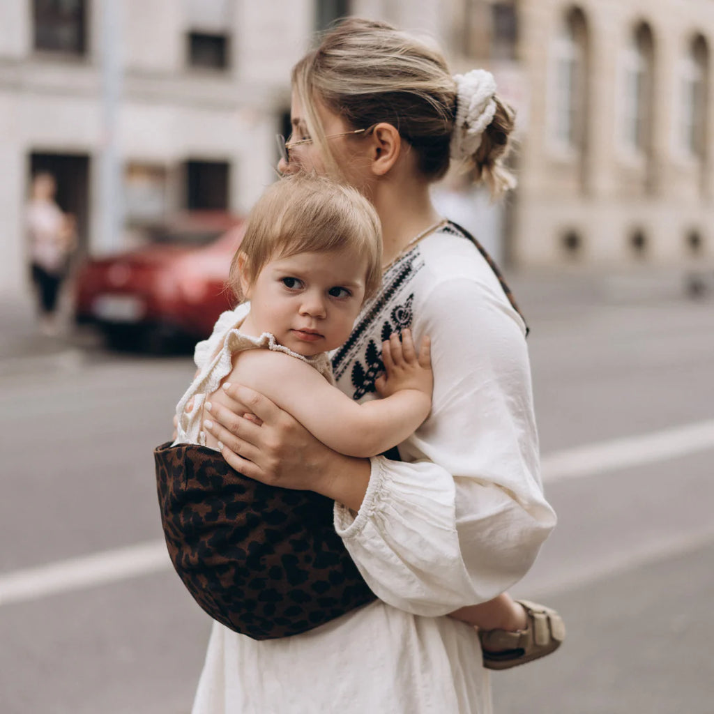 Wildride- Toddler Carrier Brown Leopard- Baby at the bank